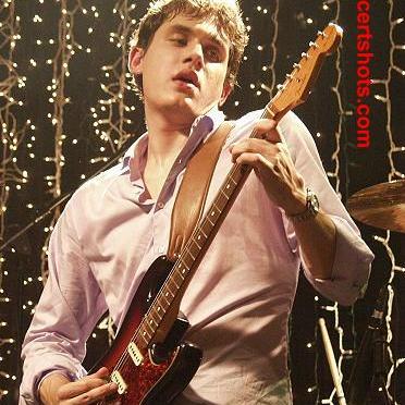 John Mayer playing guitar.
